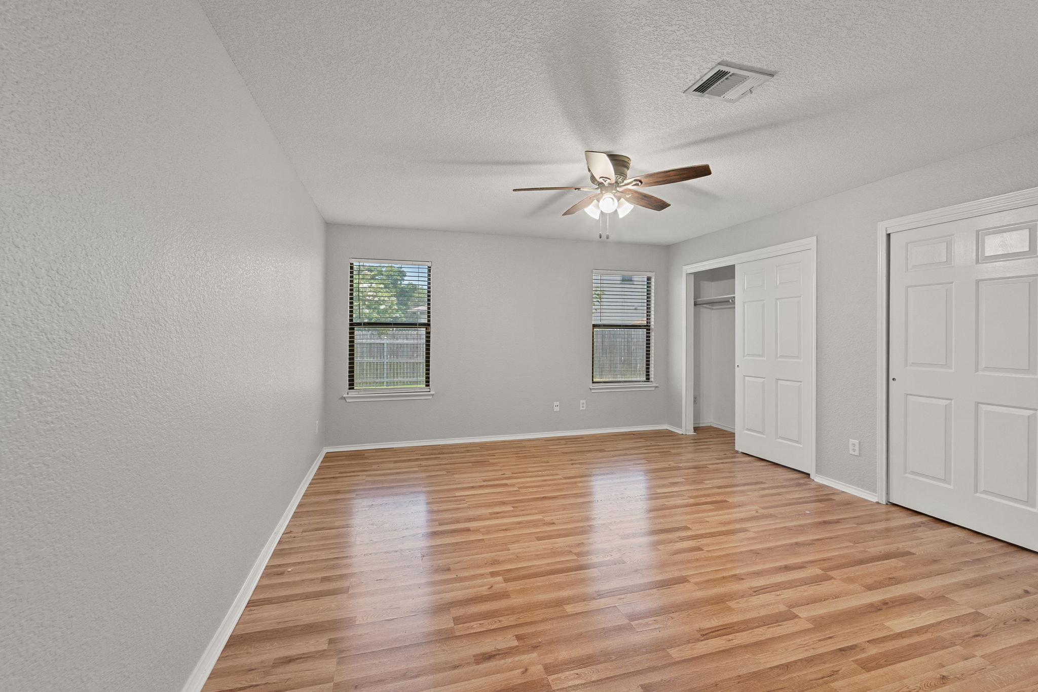 4209 Glacier Point Cove Taylor, TX 76574 - Photo 24 of 36 wooden floor in an empty room with a window