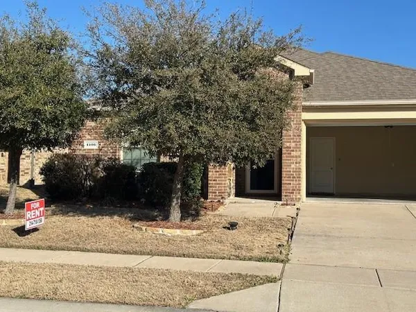 a view of a house with a yard and garage