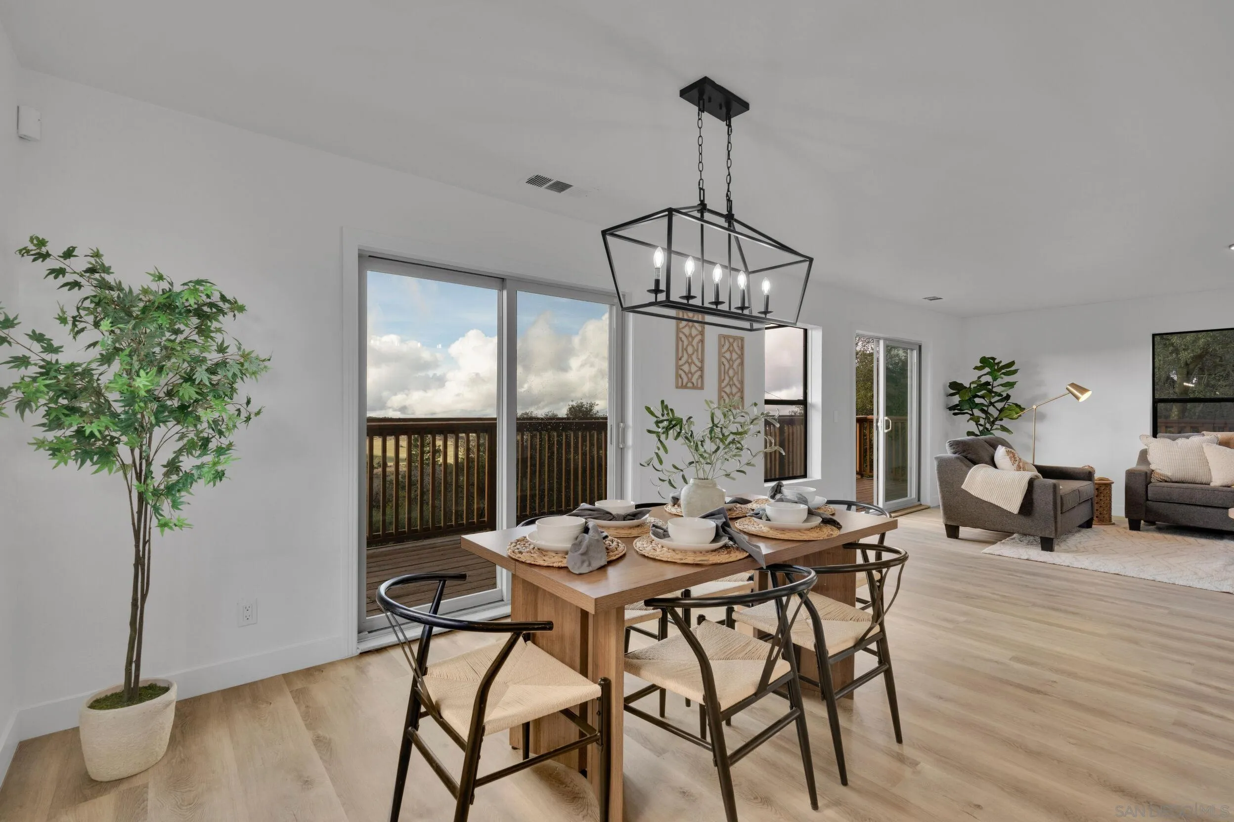 2657 Payson Drive Julian, CA 92036 - Photo 18 of 43 a view of a dining room with furniture window and wooden floor