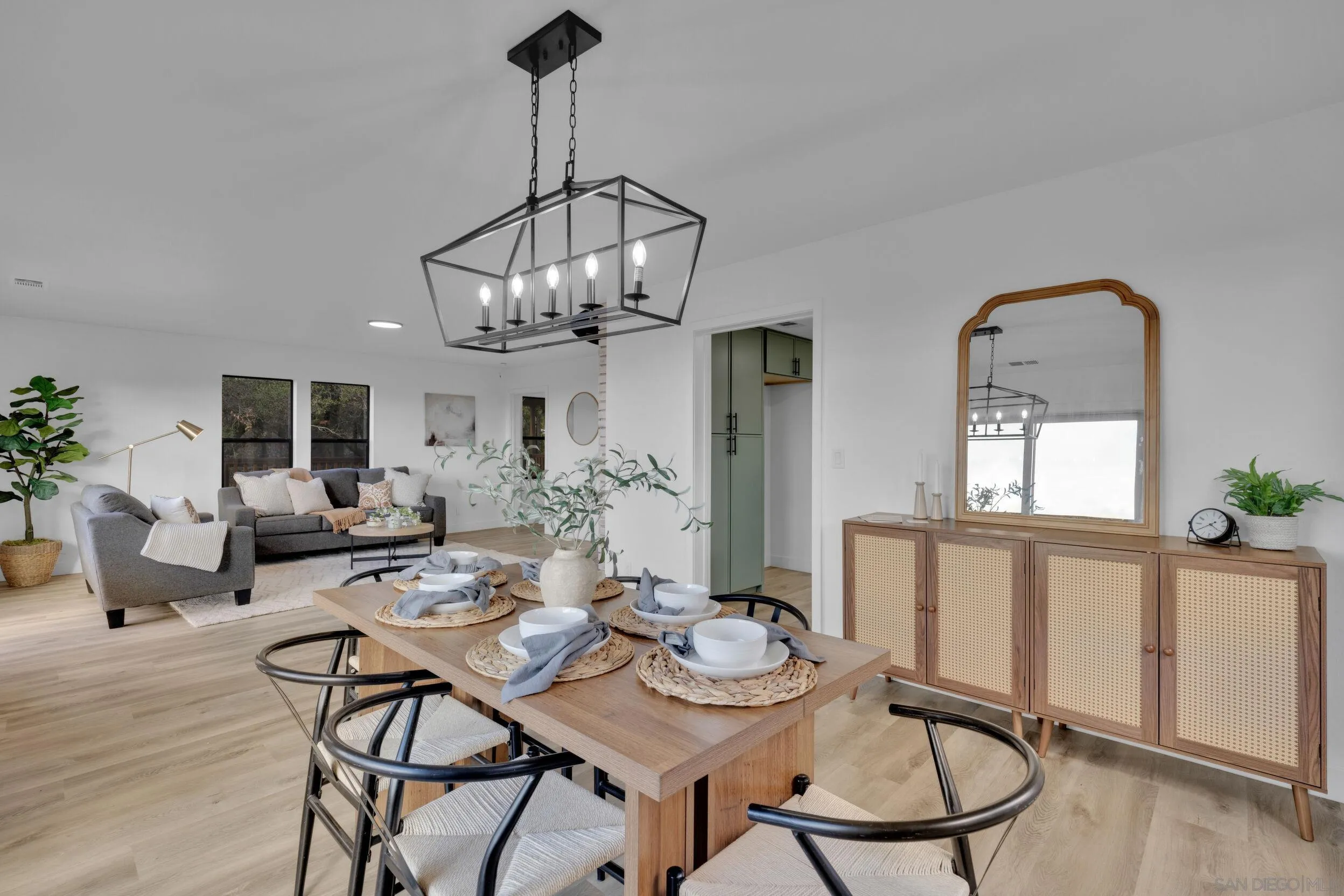 2657 Payson Drive Julian, CA 92036 - Photo 19 of 43 a view of a dining room with furniture a chandelier and wooden floor