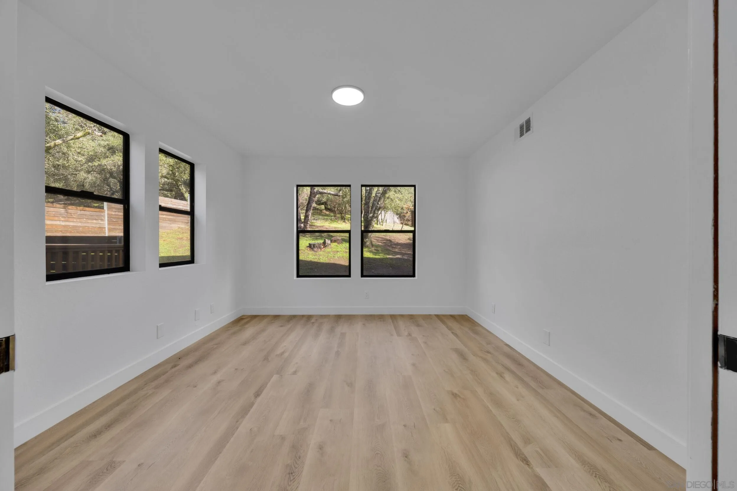 2657 Payson Drive Julian, CA 92036 - Photo 21 of 43 wooden floor in an empty room with a window