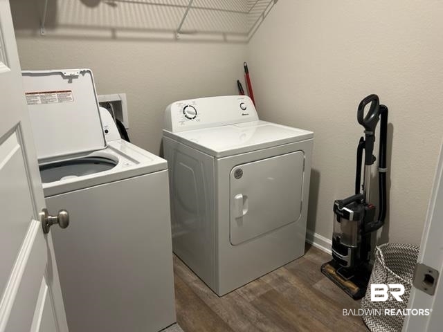 7409 Brompton Drive Foley, AL 36535 - Photo 14 of 18 Laundry room featuring washer and dryer and dark hardwood / wood-style flooring