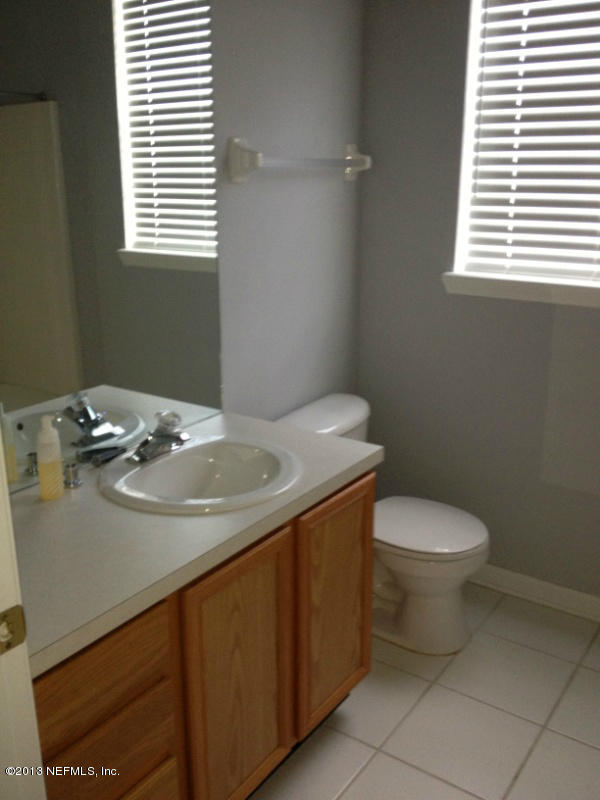 7990 Baymeadows Road East, Unit 426 Jacksonville, FL 32256 - Photo 5 of 14 a bathroom with a sink and a toilet