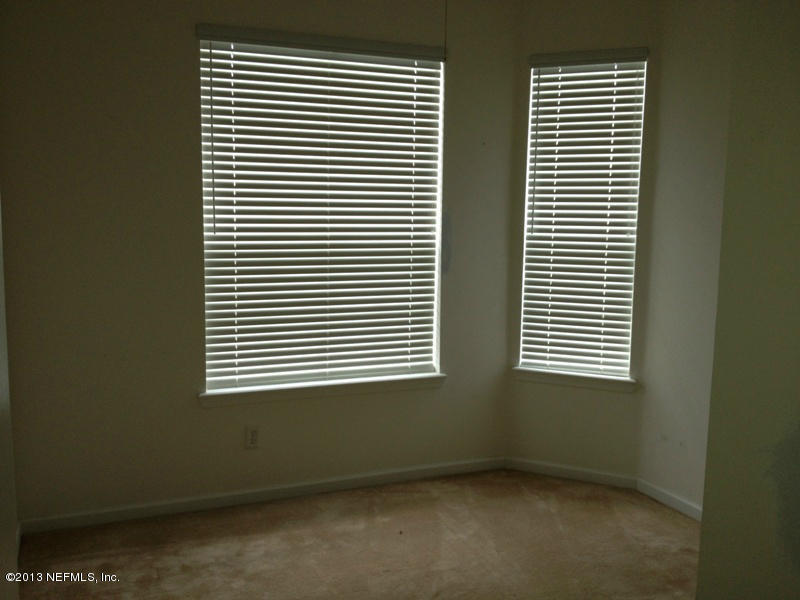 7990 Baymeadows Road East, Unit 426 Jacksonville, FL 32256 - Photo 6 of 14 an empty room with a window