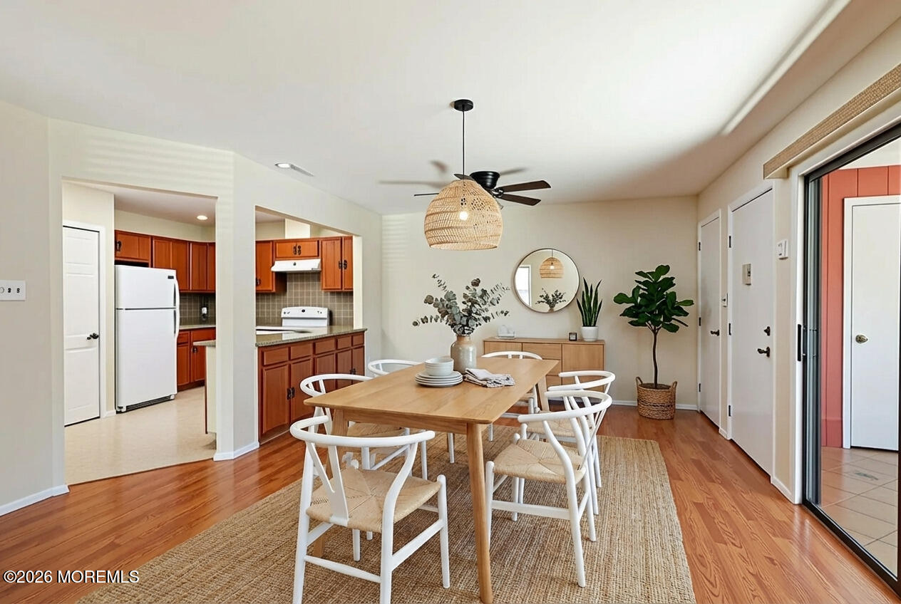 109 Lexington Court Red Bank, NJ 07701 - Photo 12 of 62 a view of a dining room with furniture and wooden floor