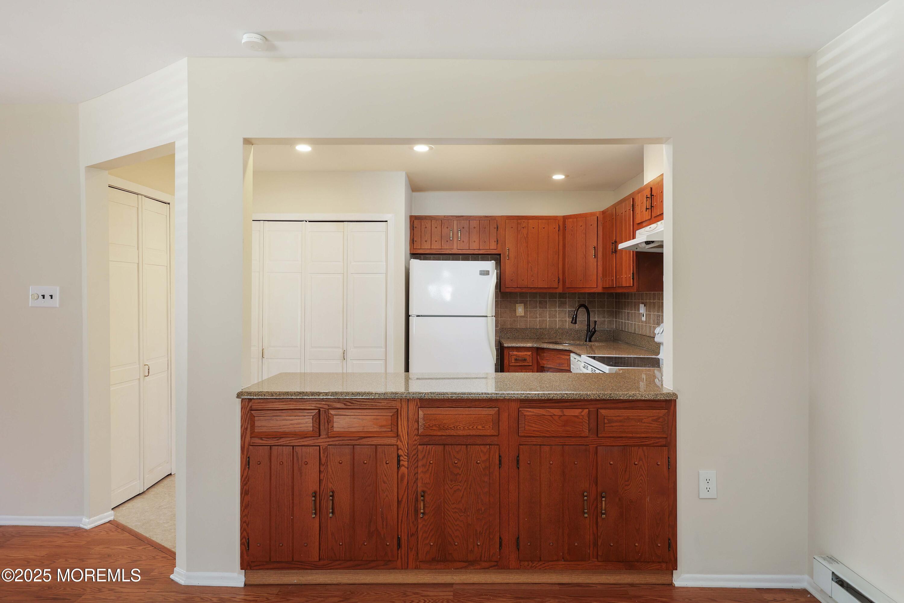 109 Lexington Court Red Bank, NJ 07701 - Photo 16 of 62 a kitchen with stainless steel appliances granite countertop a refrigerator and a sink