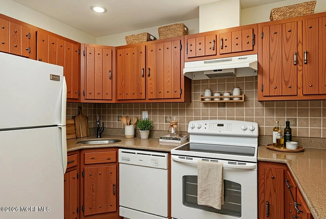 109 Lexington Court Red Bank, NJ 07701 - Photo 18 of 62 a kitchen with stainless steel appliances granite countertop a refrigerator stove a sink and dishwasher