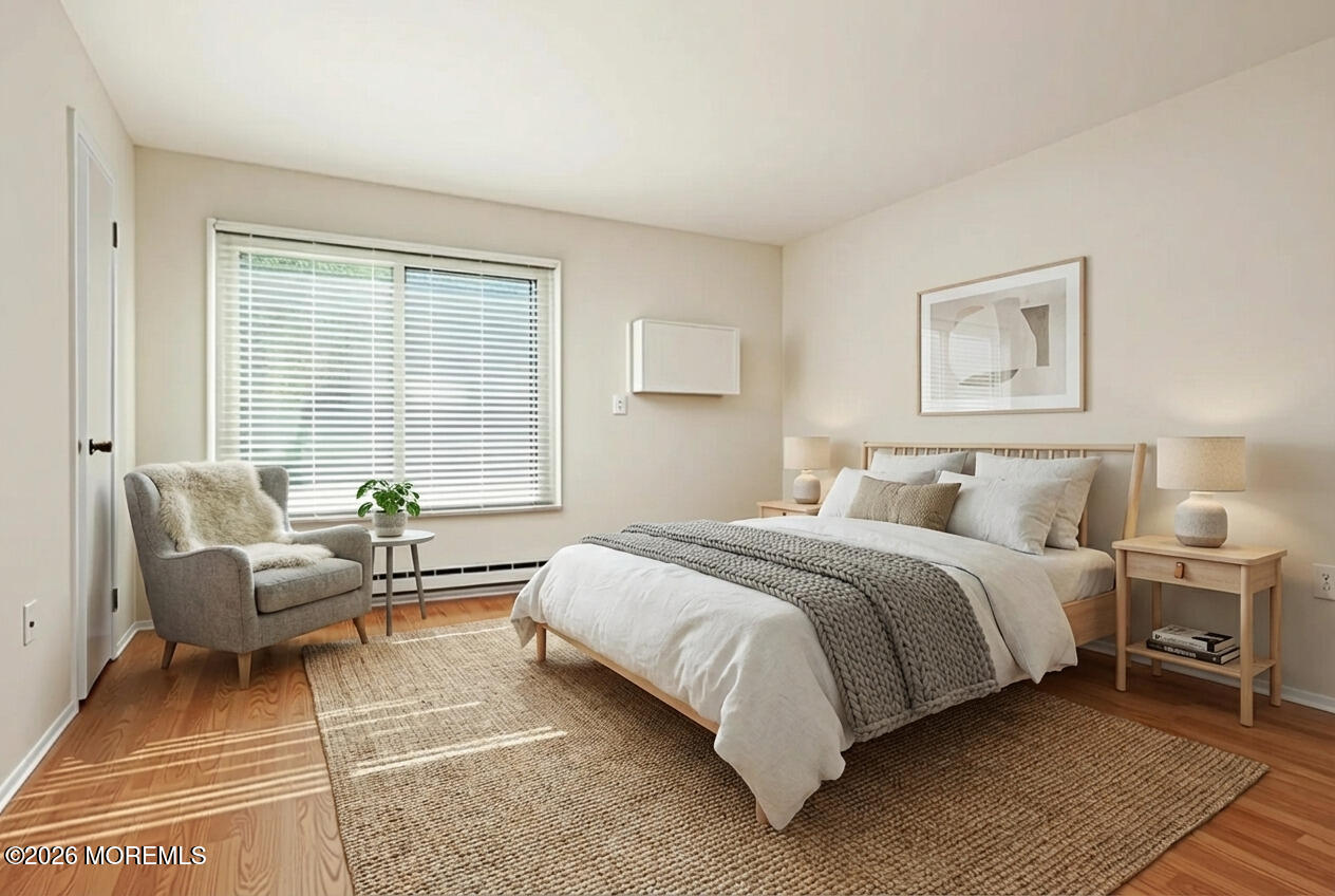 109 Lexington Court Red Bank, NJ 07701 - Photo 30 of 62 a spacious bedroom with a bed and a couch