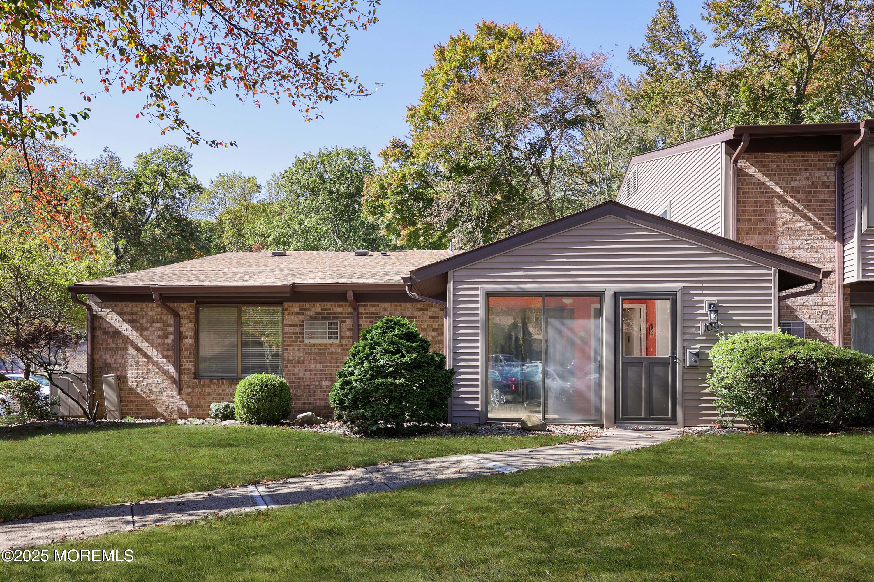 109 Lexington Court Red Bank, NJ 07701 - Photo 36 of 62 a front view of a house with a garden