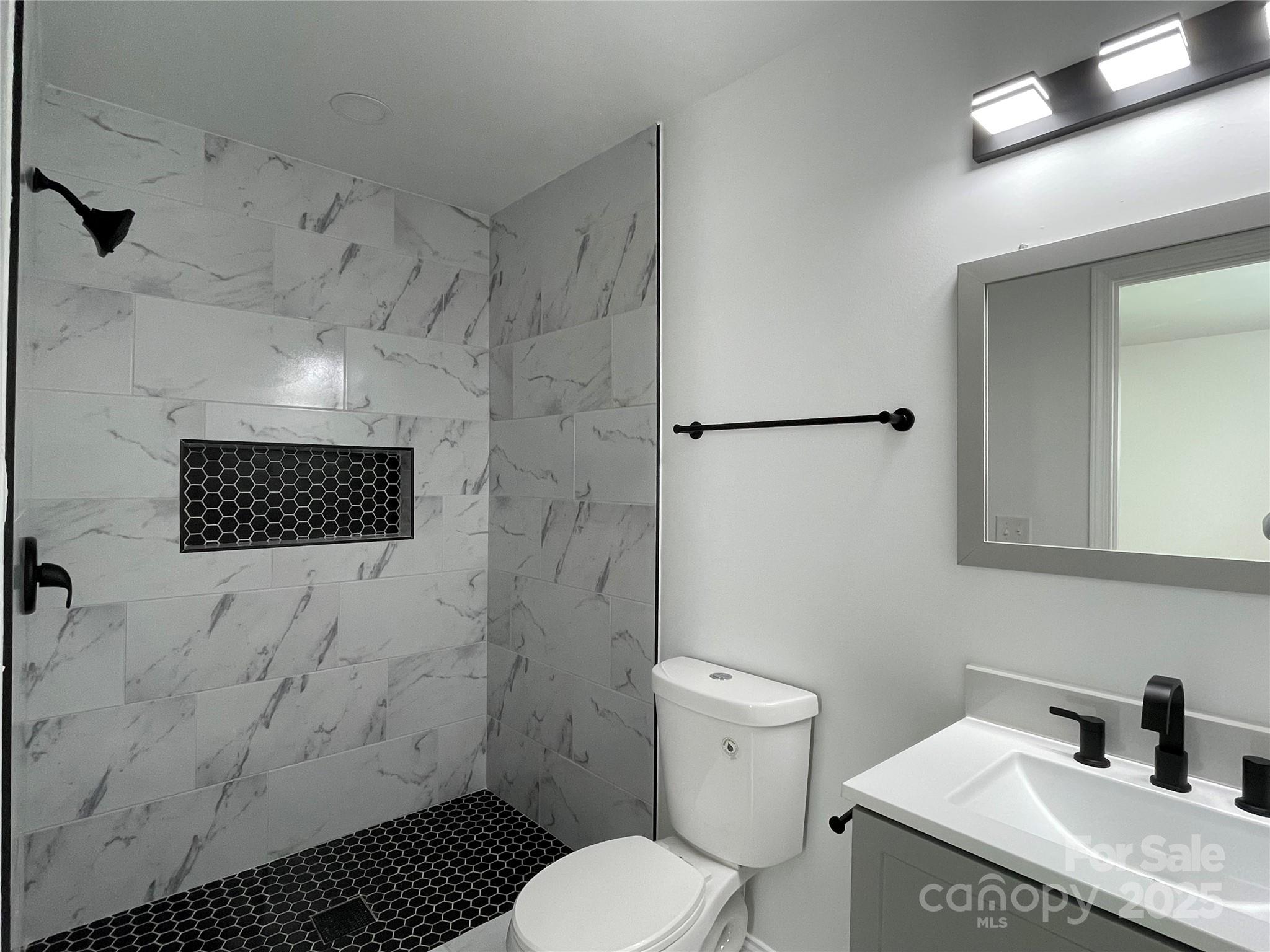 210 River Drive Gaffney, SC 29340 - Photo 11 of 18 a bathroom with a sink toilet and shower