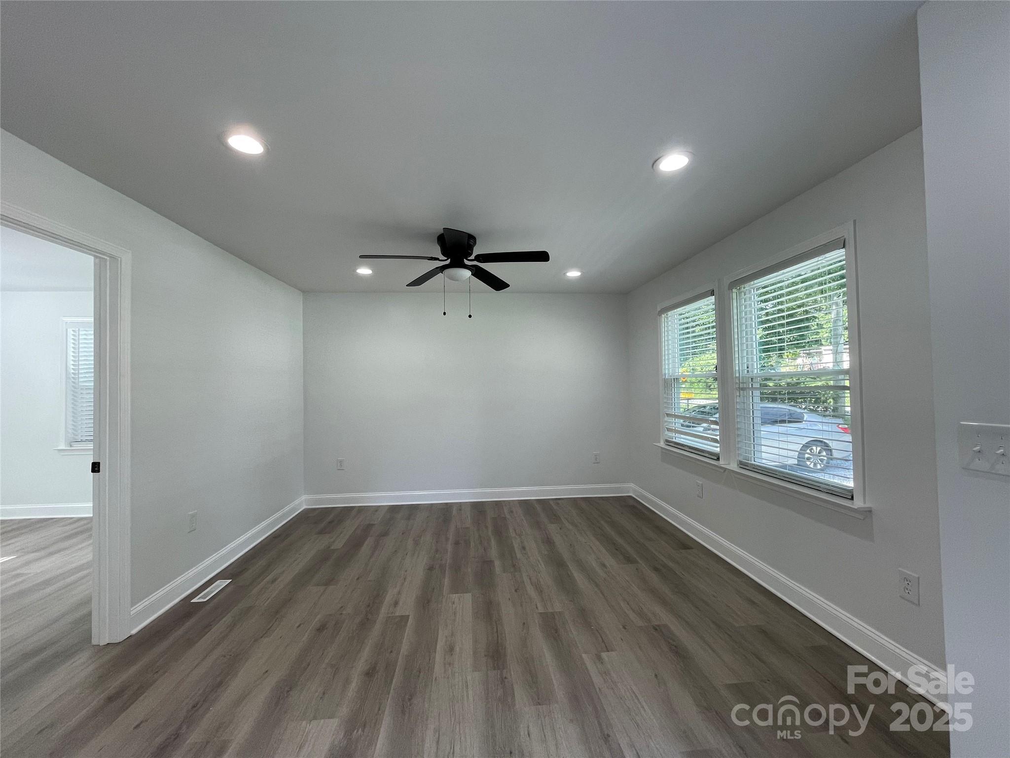 210 River Drive Gaffney, SC 29340 - Photo 13 of 18 wooden floor in an empty room with a window