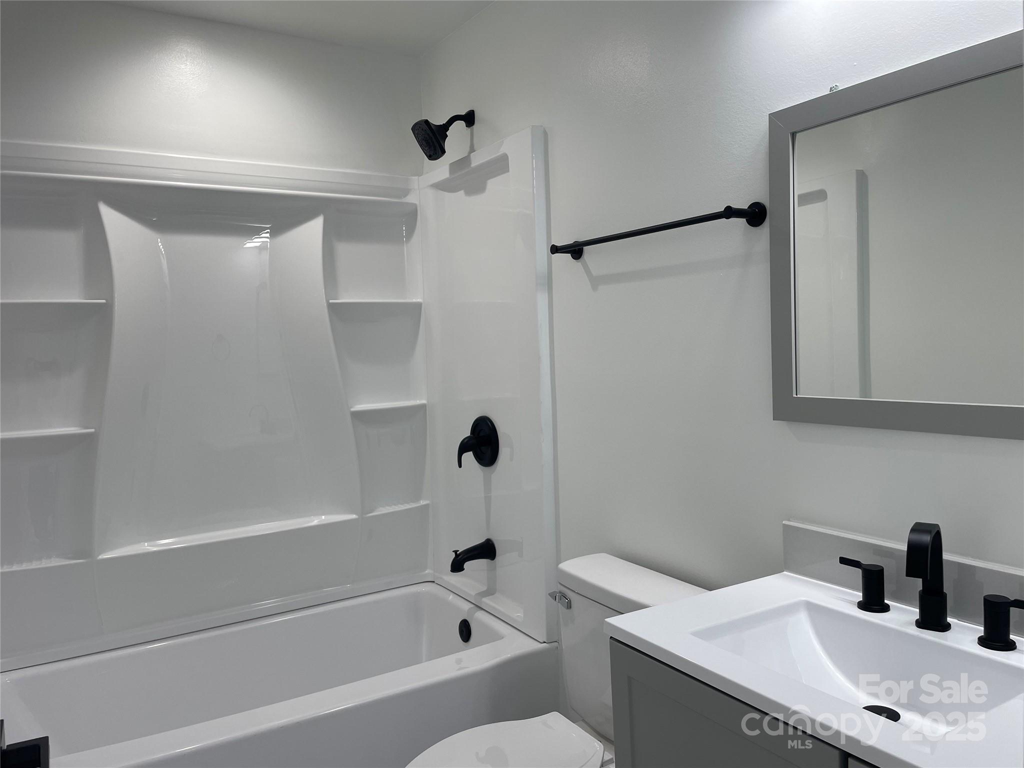 210 River Drive Gaffney, SC 29340 - Photo 17 of 18 a bathroom with a bathtub shower sink vanity and toilet