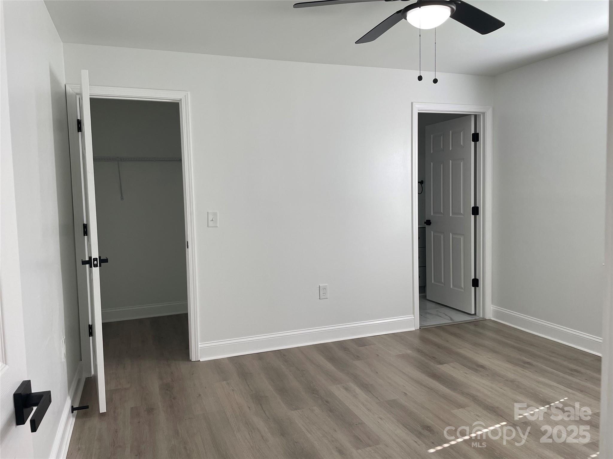 210 River Drive Gaffney, SC 29340 - Photo 10 of 18 an empty room with wooden floor closet and windows
