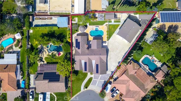 an aerial view of houses with outdoor space