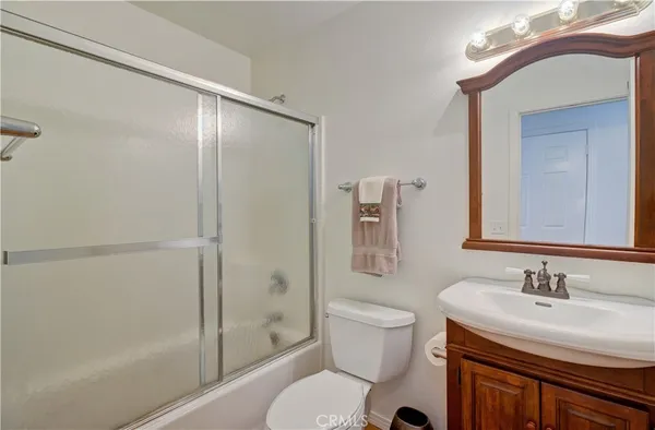 a view of wooden floor and windows in a room