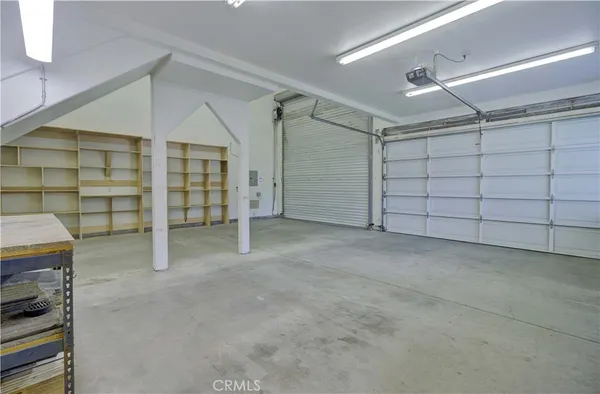 a view of a hallway with wooden floors