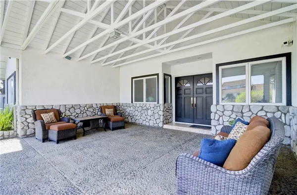 a bed room with furniture and a large window