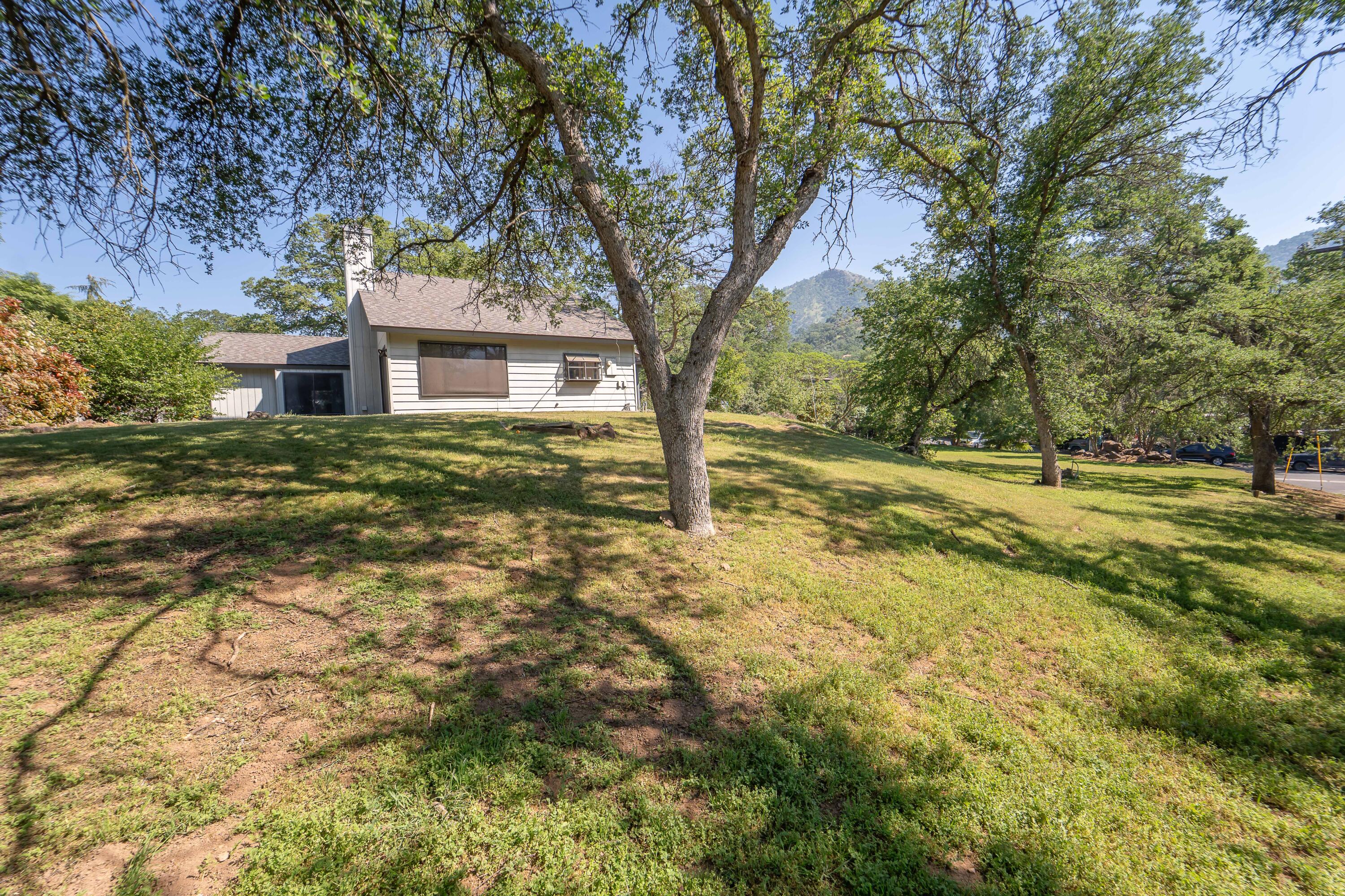 40962 Oak Ridge Drive Three Rivers, CA 93271 - Photo 27 of 36 a view of a house with a tree in the yard