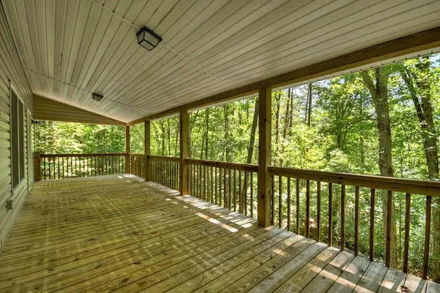 a view of balcony with wooden floor