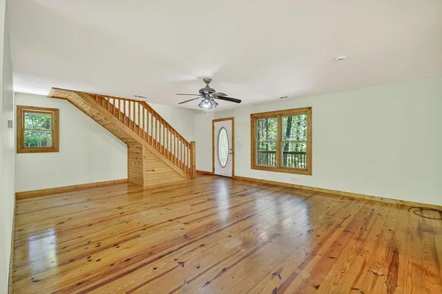 a view of an entryway with wooden floor