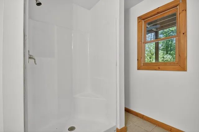 a small space with a window and a bathroom