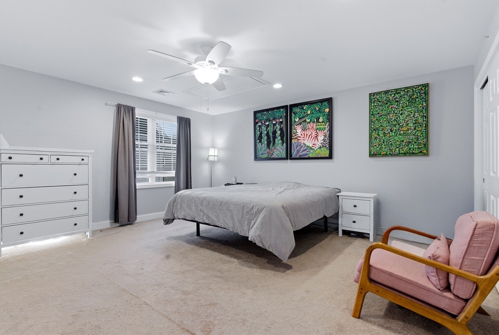 10 North Court Street, Unit 3 Fall River, MA 02720 - Photo 12 of 25 a spacious bedroom with a bed and a couch