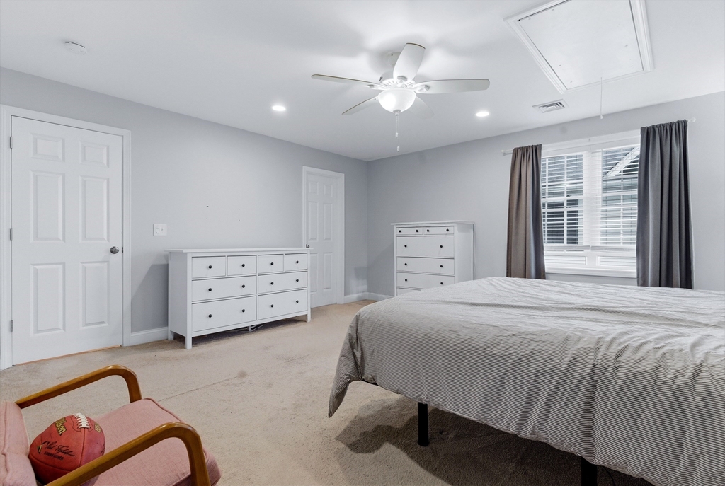 10 North Court Street, Unit 3 Fall River, MA 02720 - Photo 13 of 25 a spacious bedroom with a bed and ceiling fan
