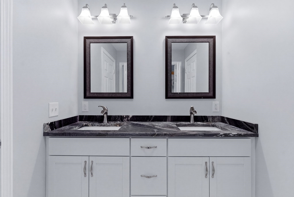 10 North Court Street, Unit 3 Fall River, MA 02720 - Photo 19 of 25 a bathroom with double sink and a mirror