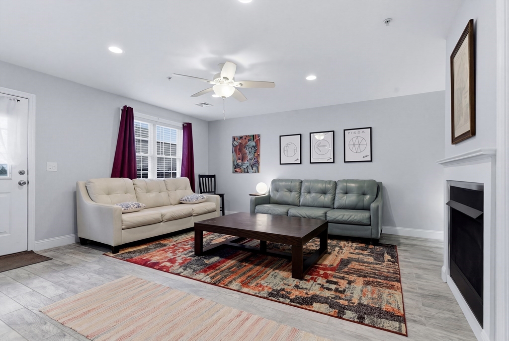 10 North Court Street, Unit 3 Fall River, MA 02720 - Photo 7 of 25 a living room with furniture and a fireplace