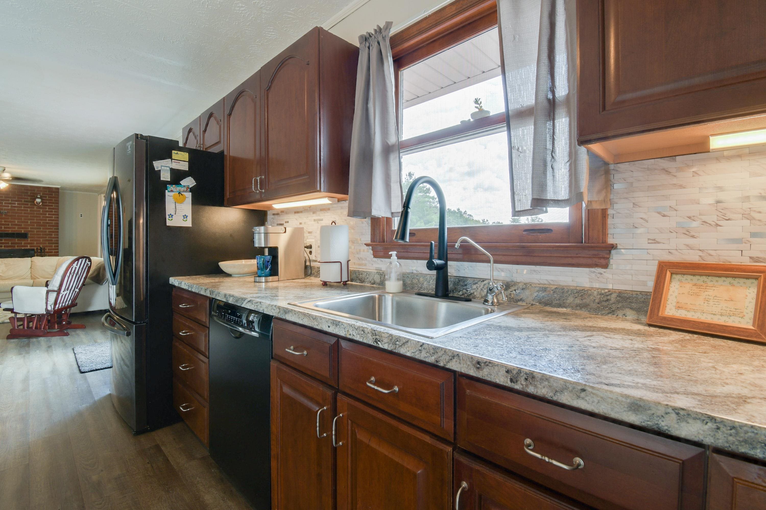 263 Craig Shop Road Mount Sidney, VA 24467 - Photo 3 of 25 a kitchen with granite countertop a sink a counter space and cabinets