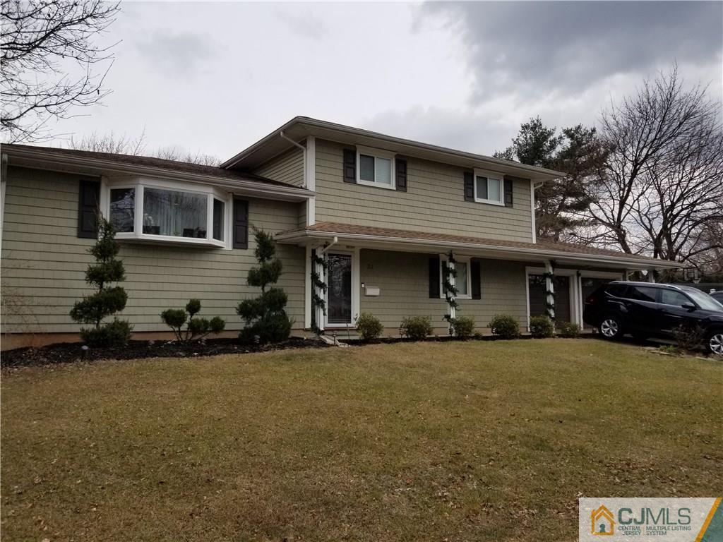 21 Barker Road Somerset, NJ 08873 - Photo 1 of 25 a front view of a house with a yard