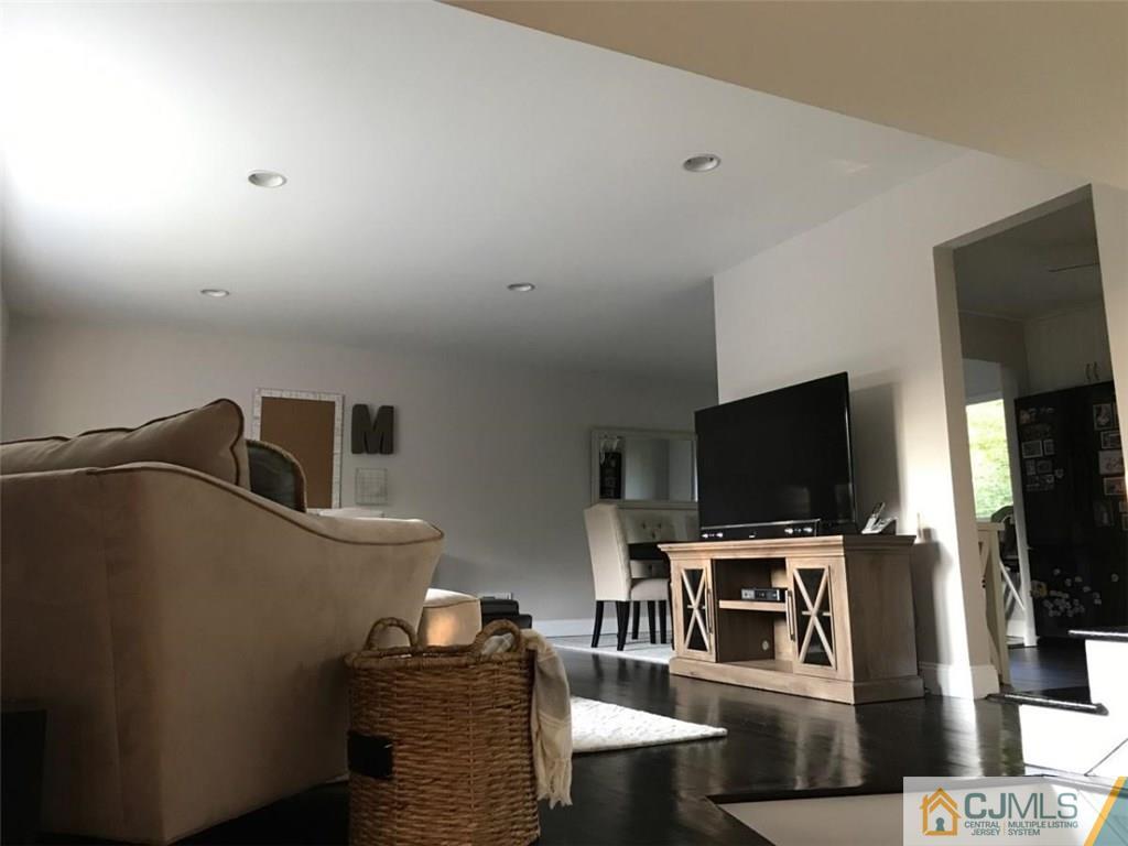 21 Barker Road Somerset, NJ 08873 - Photo 14 of 25 a living room with furniture and a flat screen tv