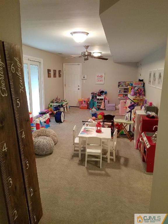 21 Barker Road Somerset, NJ 08873 - Photo 6 of 25 a room with furniture and a flat screen tv