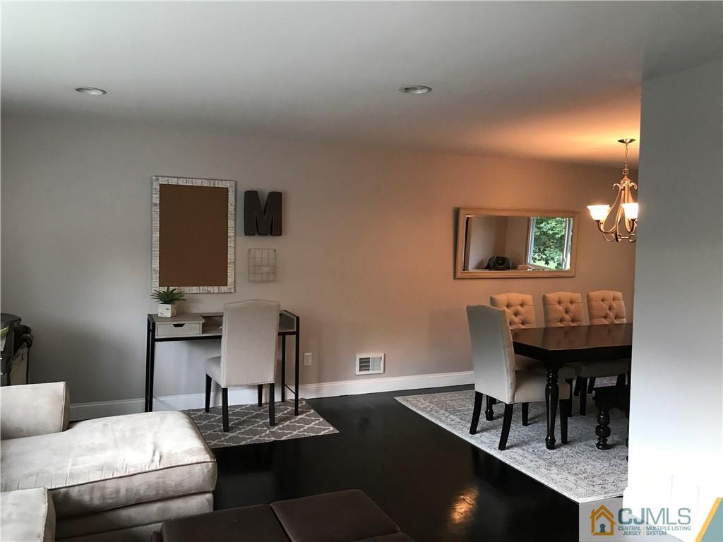 21 Barker Road Somerset, NJ 08873 - Photo 8 of 25 a living room with furniture and a bathroom