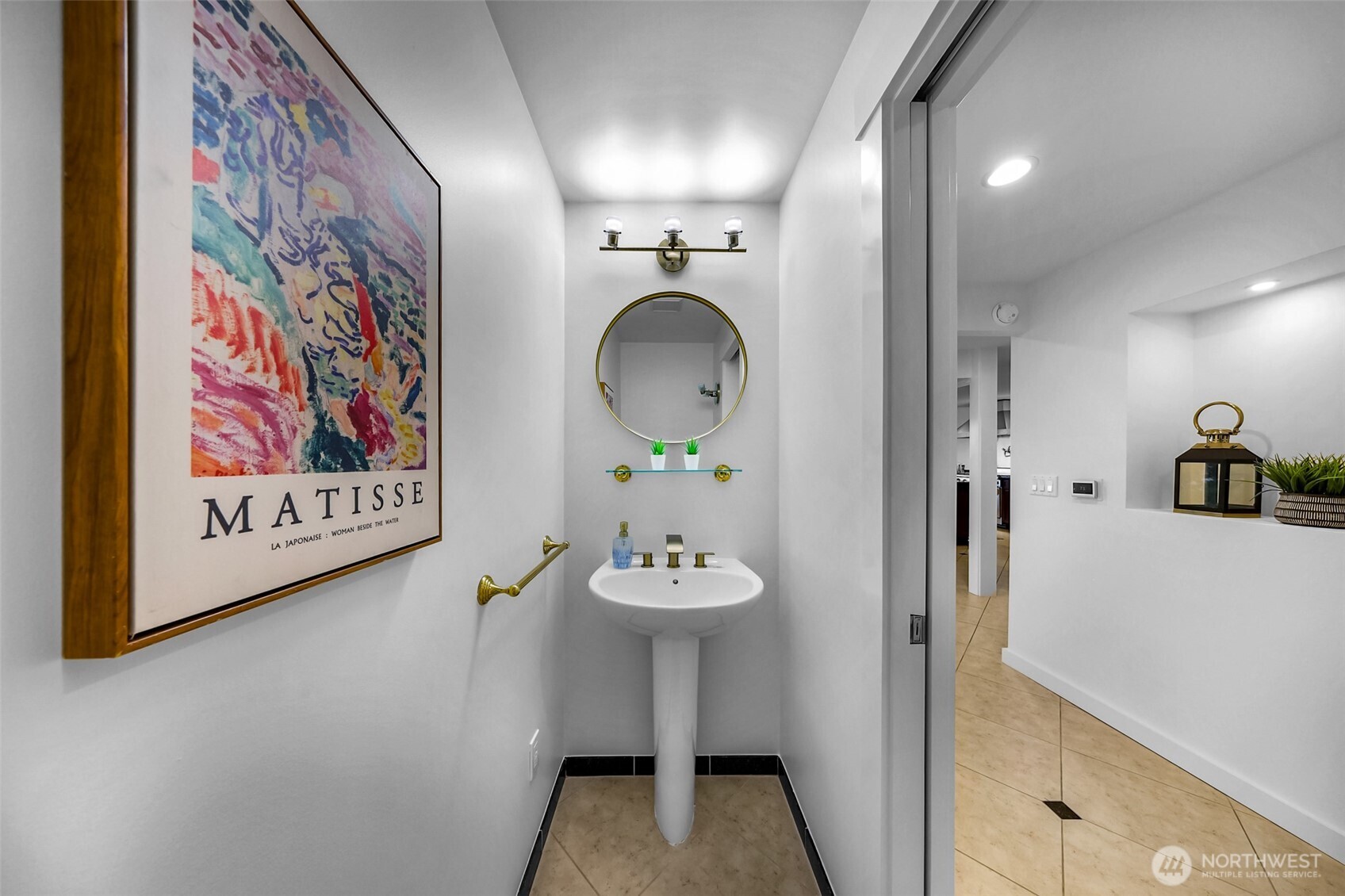 8449 West Mercer Way Mercer Island, WA 98040 - Photo 14 of 40 a bathroom with a sink and a mirror