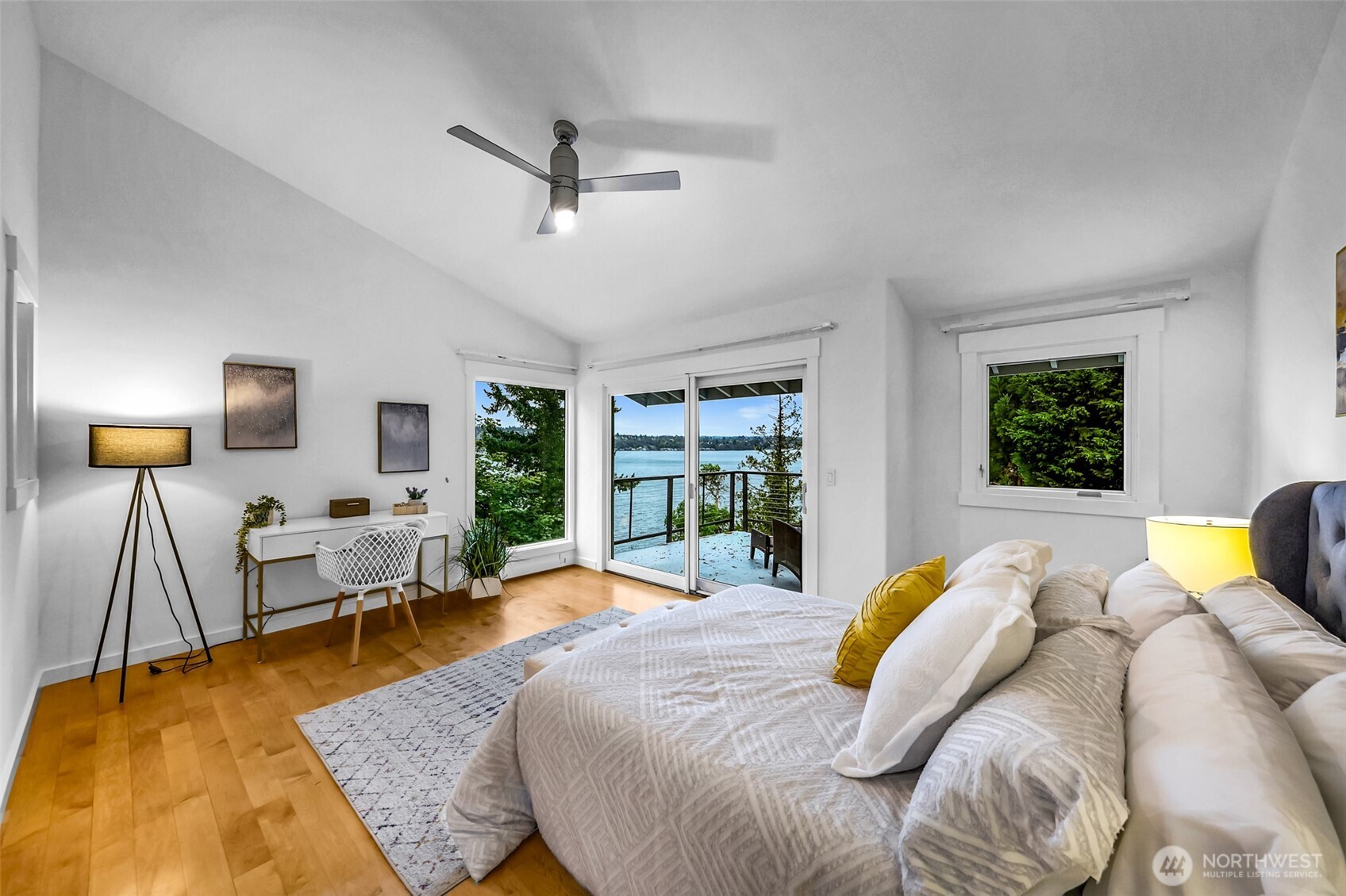 8449 West Mercer Way Mercer Island, WA 98040 - Photo 15 of 40 a bedroom with a bed and wooden floor