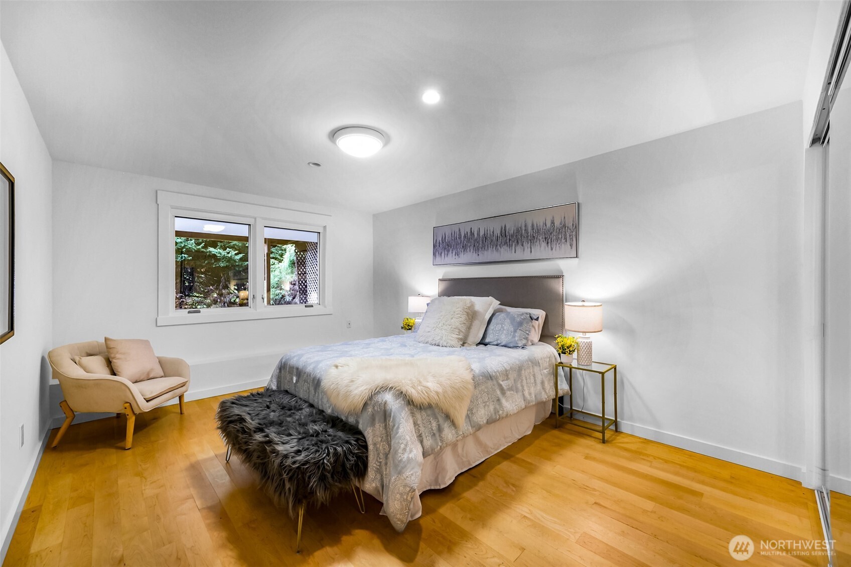 8449 West Mercer Way Mercer Island, WA 98040 - Photo 24 of 40 a bedroom with a bed and a couch