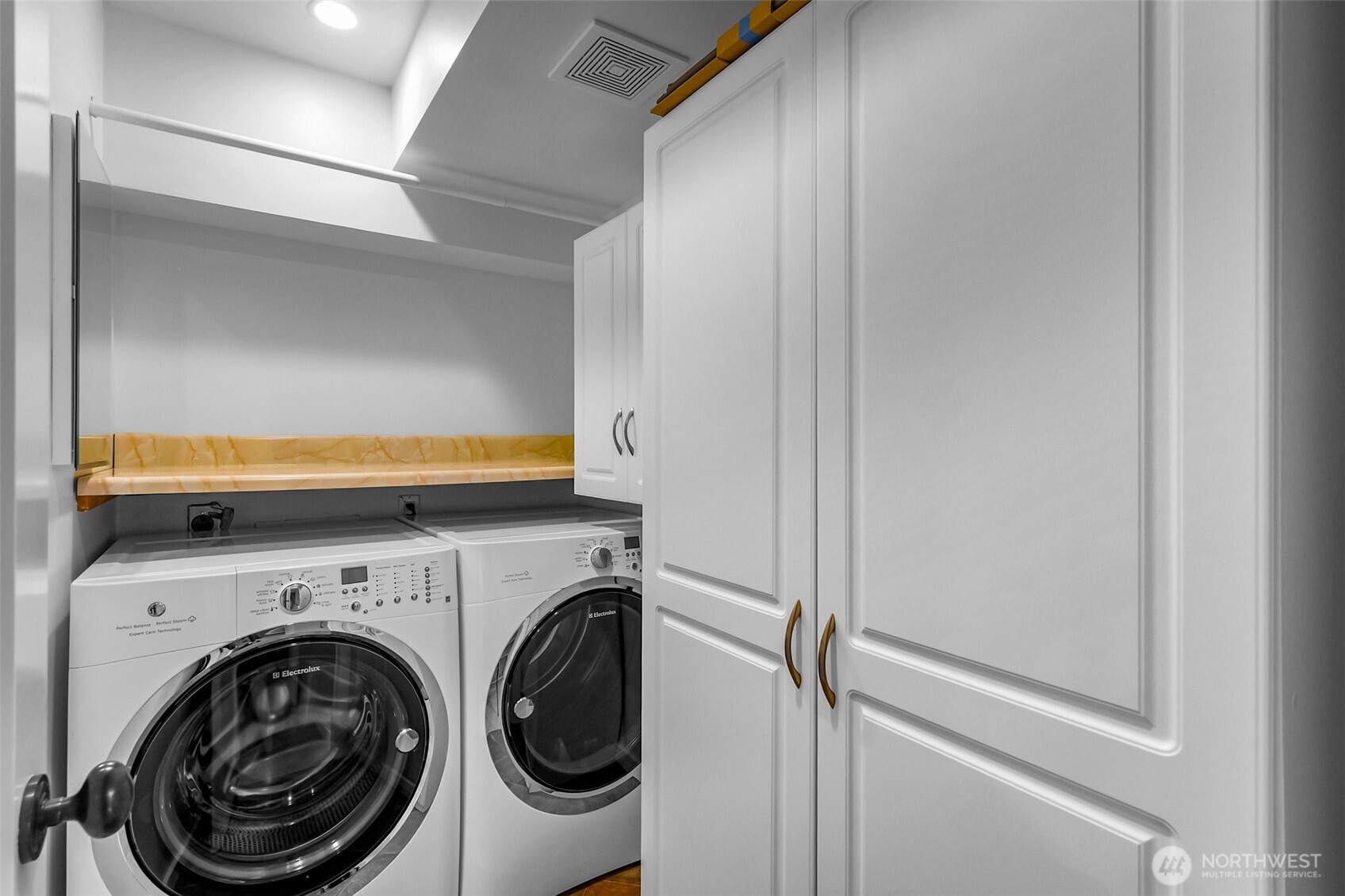 8449 West Mercer Way Mercer Island, WA 98040 - Photo 28 of 40 a view of a hallway with washer and dryer