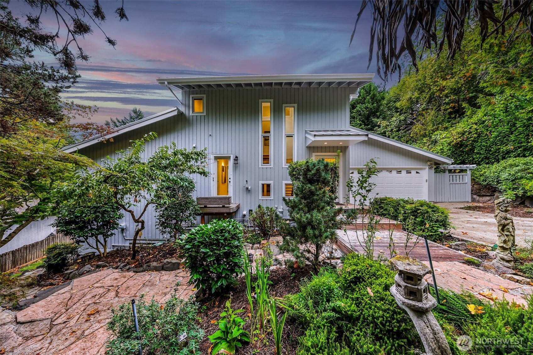 8449 West Mercer Way Mercer Island, WA 98040 - Photo 34 of 40 a front view of a house with garden