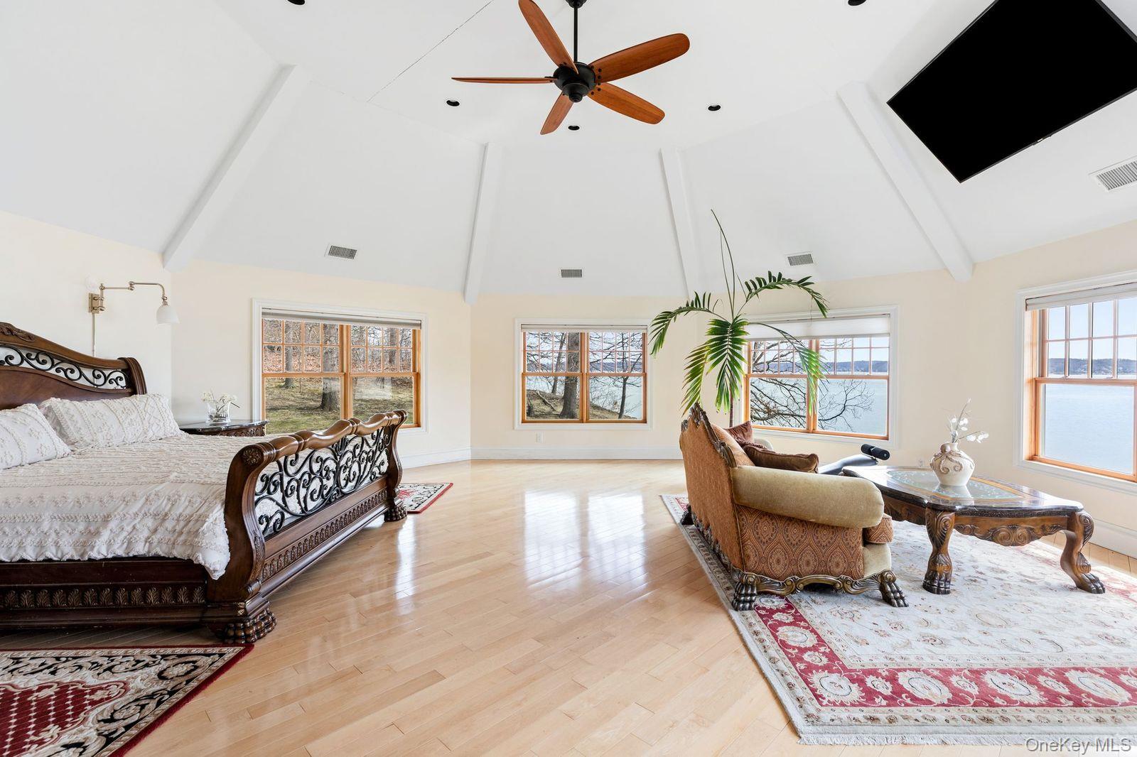 33 Beach Road Northport, NY 11768 - Photo 19 of 50 a bedroom with furniture and a flat screen tv
