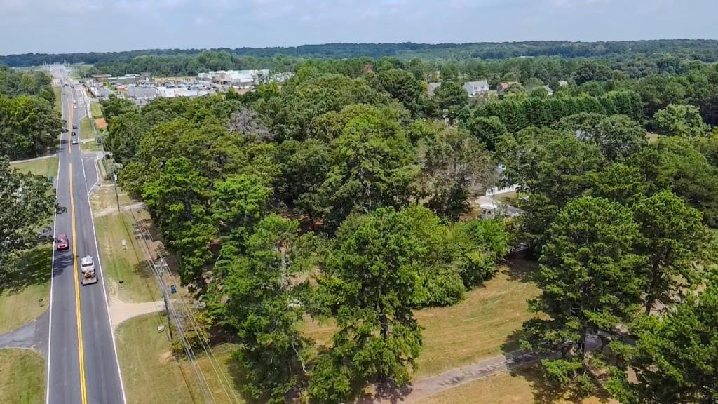 1112 Harbins Road Dacula, GA 30019 - Photo 5 of 13 a view of a lake with a building in the background