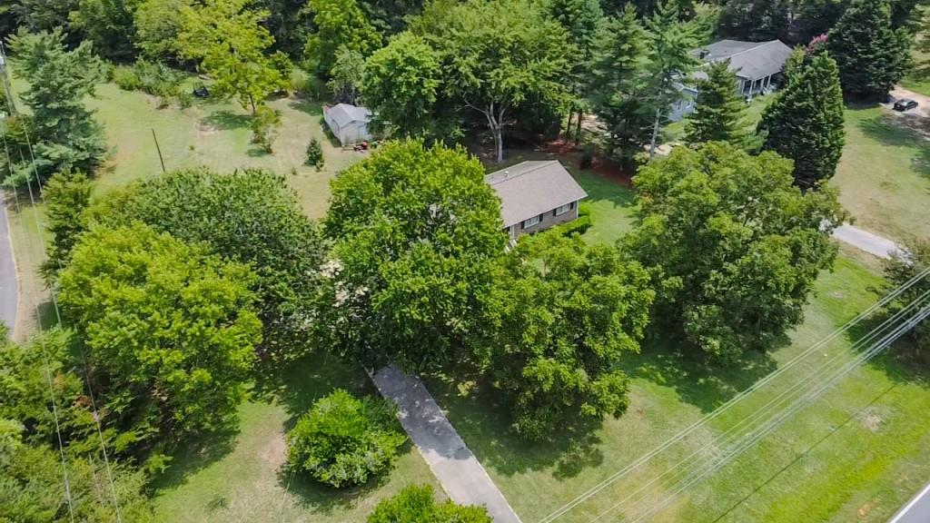 1112 Harbins Road Dacula, GA 30019 - Photo 7 of 13 a view of a garden with a fountain