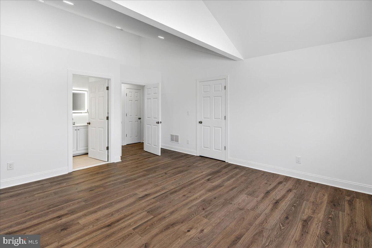 464 Sykesville Road Wrightstown, NJ 08562 - Photo 17 of 32 a view of an empty room with wooden floor and white doors