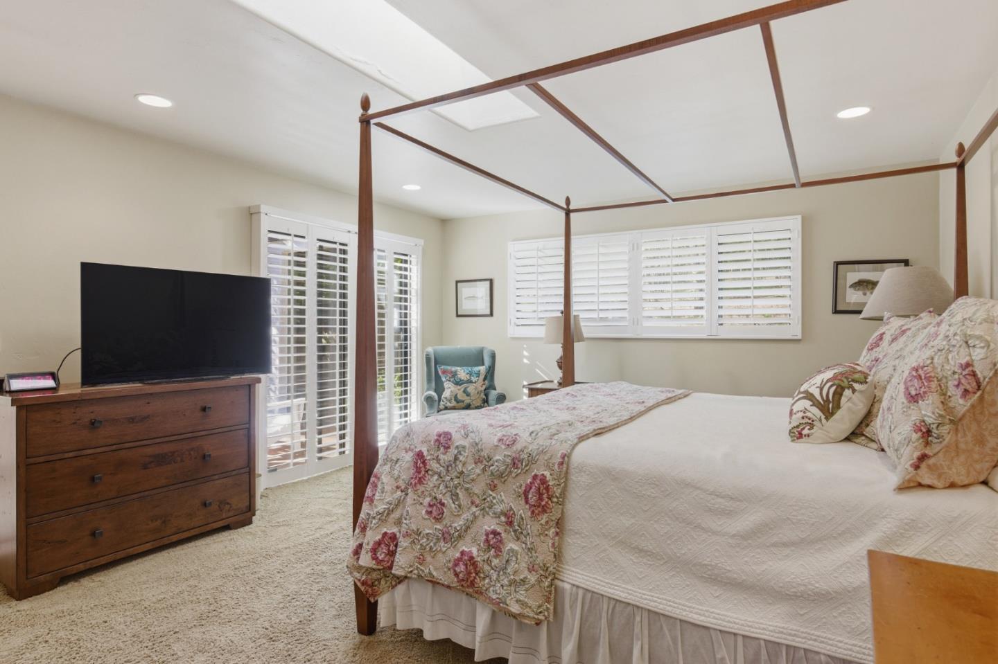 1155 Lookout Road Pebble Beach, CA 93953 - Photo 21 of 33 a bedroom with a bed and a flat screen tv