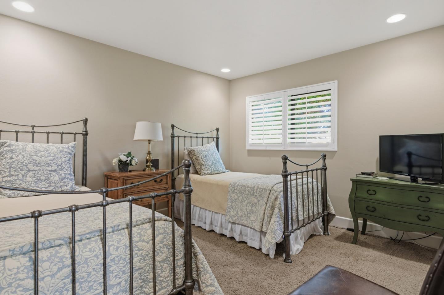1155 Lookout Road Pebble Beach, CA 93953 - Photo 24 of 33 a bedroom with a bed and a table in it