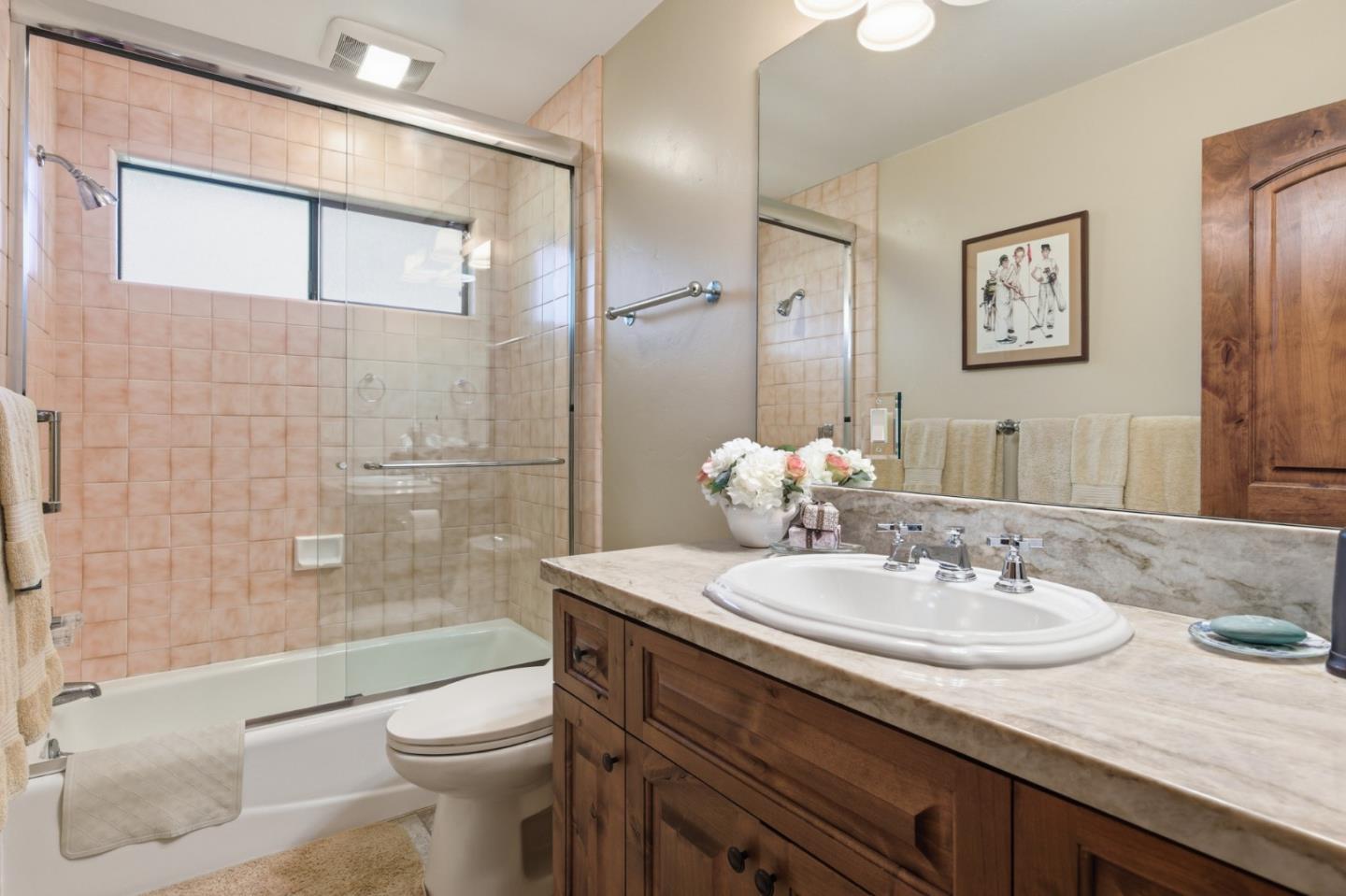 1155 Lookout Road Pebble Beach, CA 93953 - Photo 25 of 33 a bathroom with a granite countertop sink toilet and shower