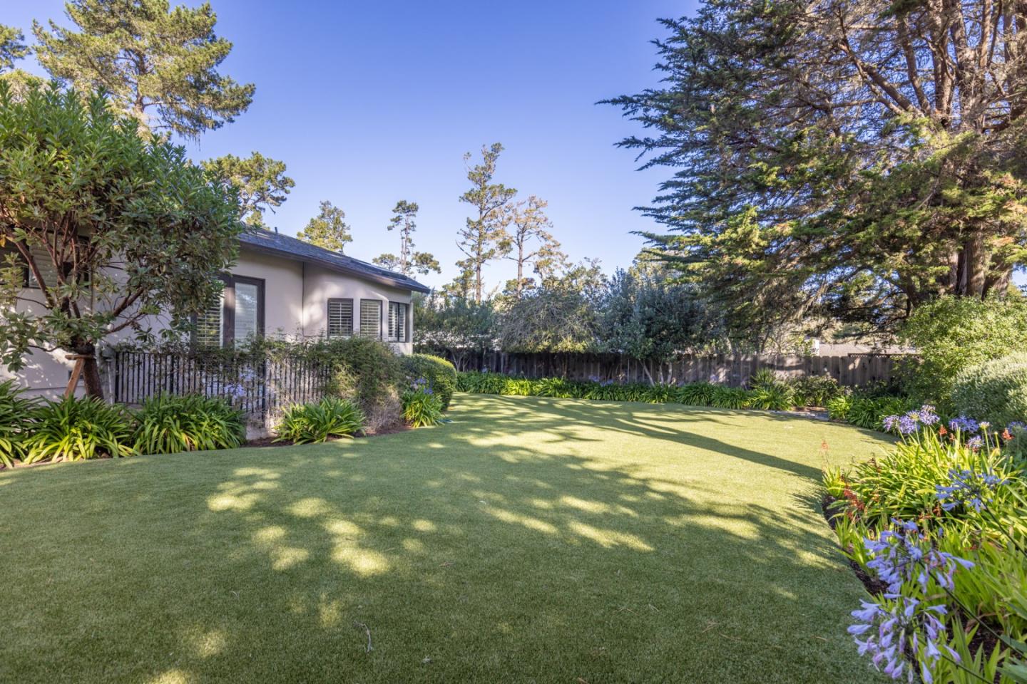 1155 Lookout Road Pebble Beach, CA 93953 - Photo 9 of 33 a view of a house with a yard and tree s