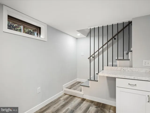 a view of a kitchen with a sink and dishwasher refrigerator freezer