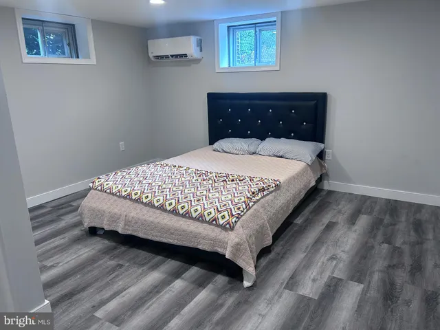 a bedroom with a bed and a view of bathroom