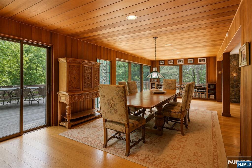 34 Cambridge Way Alpine, NJ 07620 - Photo 15 of 48 a dining room with furniture a chandelier and wooden floor